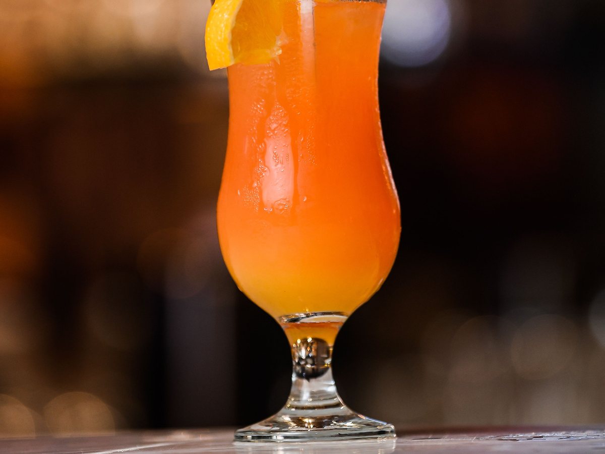 Ice cream cocktail in a glass with an orange slice